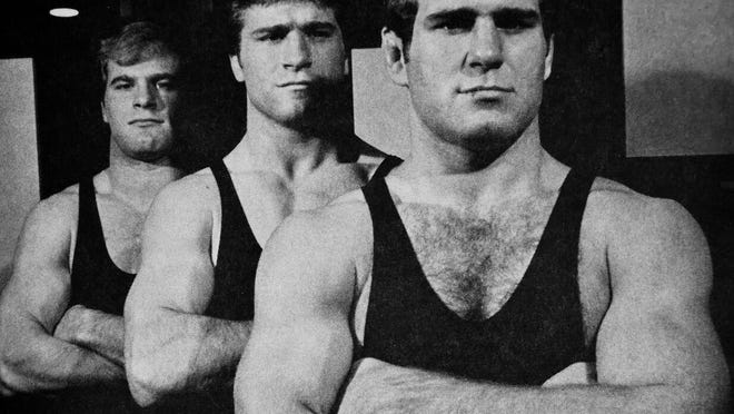 Lou Banach, left, Steve Banach, center, and Ed Banach, right, shown during their wrestling days at Iowa in 1982.