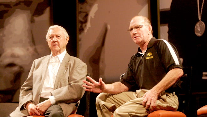 Legendary Waterloo High School wrestling coach Bob Siddens talks with Dan Gable during "This Is Your Life, Dan Gable" at the Coralville Marriott Hotel and Convention Center kicking off FryFest 2011 on Friday, September 2 in Coralville, IA.
