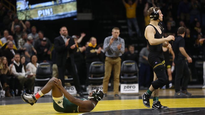 Iowa's Spencer Lee pins Michigan State's Rayvon Foley as they wrestle at 125 pounds at Carver-Hawkeye Arena on Friday, Jan. 5, 2018.