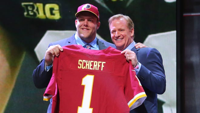 Former Iowa Hawkeye Brandon Scherff poses for a photo with NFL commissioner Roger Goodell after being selected as the fifth overall pick by the Washington Redskins in the first round of the 2015 NFL Draft.