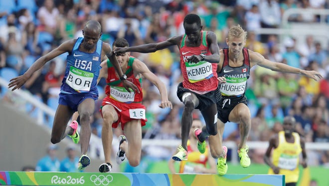 United States' Hillary Bor, left, and Kenya's Ezekiel Kemboi, second right, compete in a men's 3000-meter steeplechase heat during the athletics competitions of the 2016 Summer Olympics at the Olympic stadium in Rio de Janeiro, Brazil, Monday, Aug. 15, 2016.