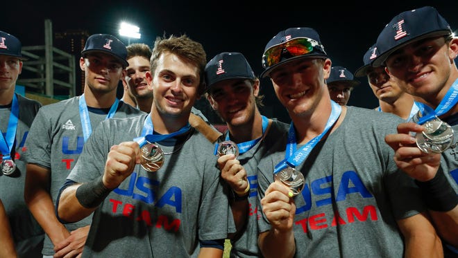 Iowa Hawkeyes infielder Mitchell Boe (4), outfielder Justin Jenkins (6), catcher Tyler Cropley (5) and infielder Tanner Wetrich (16) show off their silver medals during their gold medal game against Japan Tuesday, August 29, 2017 at Tianmu Baseball Stadium in Taipei, Taiwan.