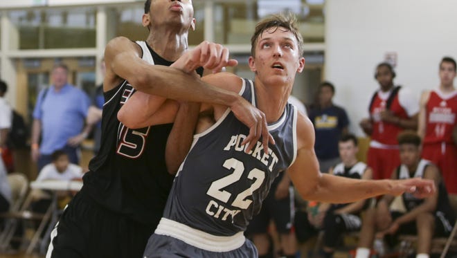 Senior, Jack Nunge #22 of the Pocket City team blocks  Chandler Fointno #23 of Cincy Lakers during the Adidas Invitational at Warren Central High School on July 6, 2016. The Cincy Lakers won the game, 61-57.
