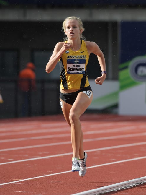 Karissa Schweizer of Missouri wins the women's 5,000 at the NCAA Track and Field Championships on Saturday in Eugene, Ore.
