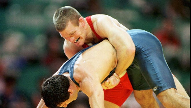 USA's Tom Brands, (top), was a winner in the 62kg weight class, of freestyle wrestling, over Magomed Azizov of Russia on Aug. 2, 1996.