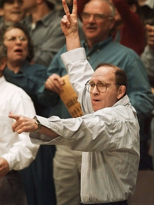 Iowa coach Dan Gable, who is on a year's sabbatical from coaching the team, calls for a two-point takedown for Iowa wrestler Dough Schwab during his 126-pound match against Oklahoma State's Eric Guerrero, Saturday, Feb. 14, 1998, in Iowa City.