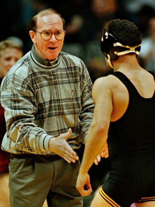 On Feb. 18, 1996 in Iowa City, Iowa coach Dan Gable meets 118-pounder Mike Mena at the edge of the mat after Mena pinned Iowa State's Jason Nurre in 4:47.