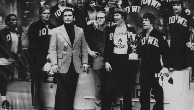 Iowa's 10 wrestlers who qualified for the NCAA Championships after winning the Big Ten Conference title in Iowa City in 1976, when Dan Gable (pictured in the middle) was an assistant coach under Gary Kurdelmeier.
