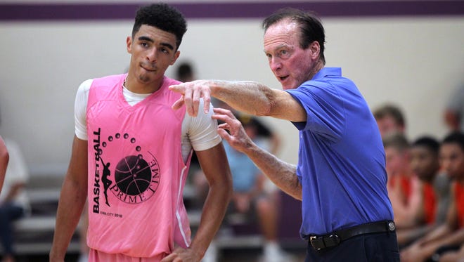 UNI incoming freshman Isaiah Brown talks with Randy Larson during Prime Time League action at the North Liberty Community Center on Thursday, July 7, 2016.