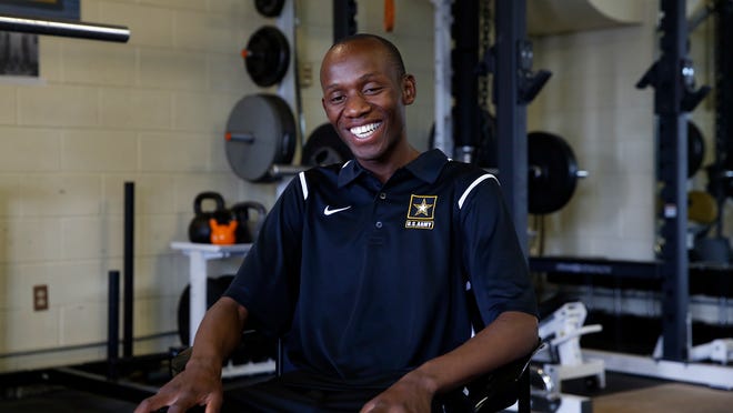 In this July 19, 2016 photo, Kenyan-born U.S. Army Sgt. Hillary Bor sits in the gym inside the U.S. Army's World Class Athlete Program, at Fort Carson Army Base, outside Colorado Springs, Colo. Bor and three other runners of Kenyan descent have taken a unique path to the Olympics through enlisting in the Army, earning U.S. citizenship, training with the military branch's World Class Athlete Program and making Team USA. (AP Photo/Brennan Linsley)