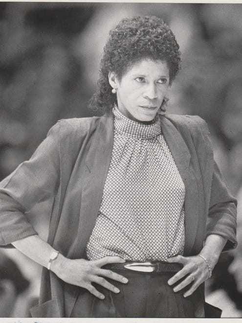 University of Iowa women's basketball coach C. Vivian Stringer sizes up situation during game with Minnesota. 

Register staff photo, taken Jan. 11, 1985.
Published in the Register Nov. 15, 1990.