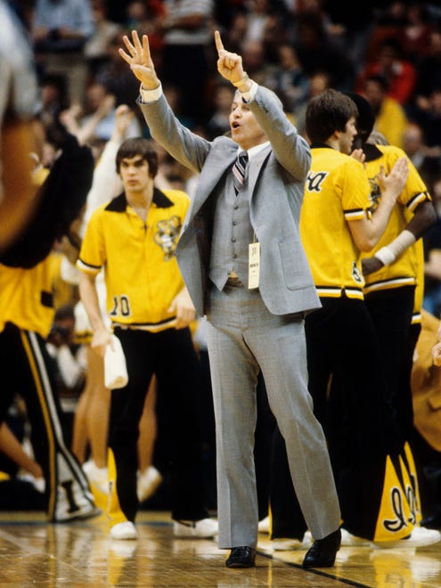 Iowa Hawkeyes head coach Lute Olson signals from the sideline during the 1980 NCAA Final Four in Indianapolis.