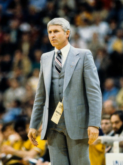 Iowa Hawkeyes head coach Lute Olson signals from the sideline during the 1980 Final Four at Market Square Arena in Indianapolis.