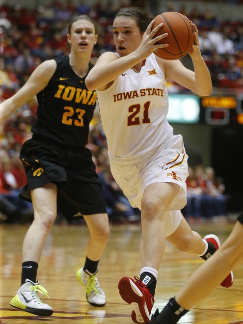 Iowa State's Bridget Carleton drives the ball past Iowa's Christina Buttenham during the Cy-Hawk women's basketball game at Hilton Coliseum in Ames on Friday.