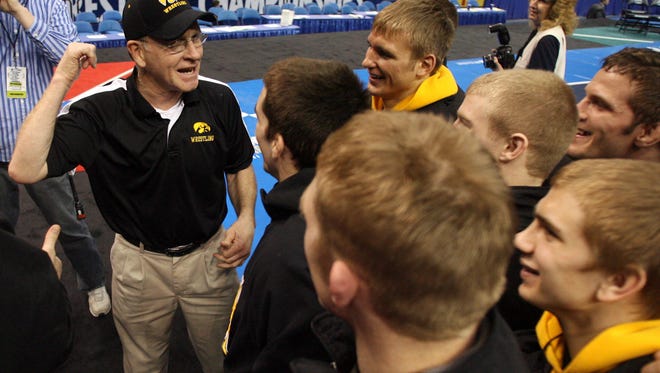 Iowa legend Dan Gable visits with the team on stage after the Hawkeyes won the 2008 NCAA Championships on March 22, 2008, at Scottrade Center in St. Louis.