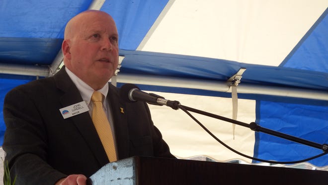 Coralville Mayor John Lundell speaks at the groundbreaking of the the Coralville arena on May 16, 2018.