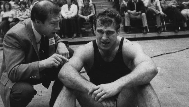 In this Feb. 20, 1982 photo, Iowa coach Dan Gable has a word with Lou Banach after an 8-8 draw against Iowa State's Perry Hummel.