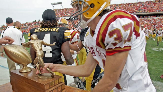 Iowa State kicker Bret Culbertson grabs the Cy-Hawk Trophy after the Cyclones defeated Iowa, 15-13, on Sept. 15, 2007 at Jack Trice Stadium in Ames. Culbertson's five field goals accounted for all of Iowa State's points.