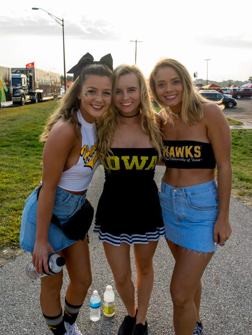 Claire Moline, 19, of Ames, Morgan Roys, 19 and Alex Wilson, 19, both of Iowa City, showing support for the hawkeyes at the 2017 Iowa Vs. Iowa State Game.