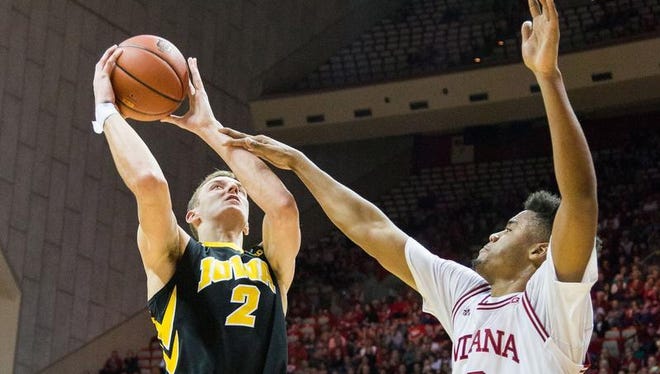 Iowa Hawkeyes forward Jack Nunge (2) shoots the ball and is fouled by Indiana Hoosiers forward Juwan Morgan (13) in the second half of the game at Assembly Hall.