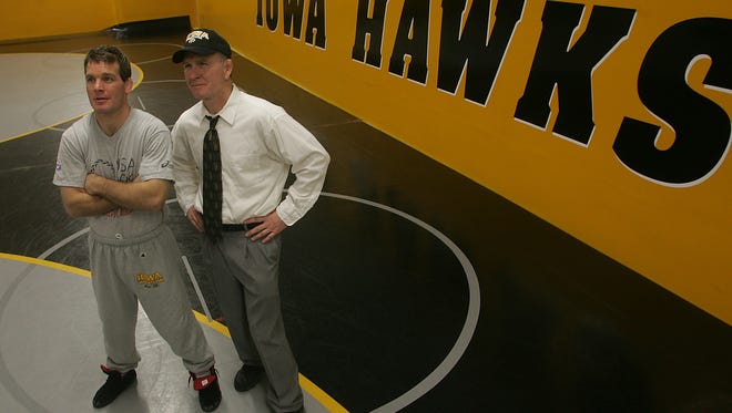 Head coach Tom Brands and assistant coach Dan Gable pose at the Iowa Wrestling Media Day, November 7, 2006 at Carver Hawkeye Arena, in Iowa City.