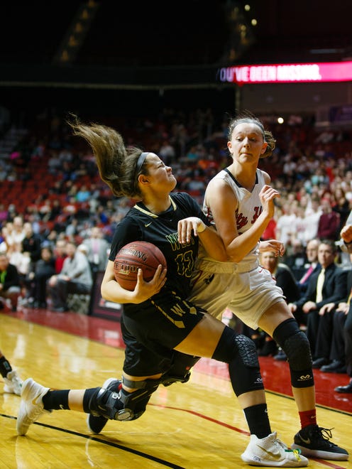 Iowa City, West's Rachael Saunders (13) grabs a loose ball from Iowa City, City High's Aubrey Joens (23) during the first half of their 5A state championship game at Wells Fargo Arena on Friday, March 2, 2018, in Des Moines. West takes a 21-16 lead into halftime.