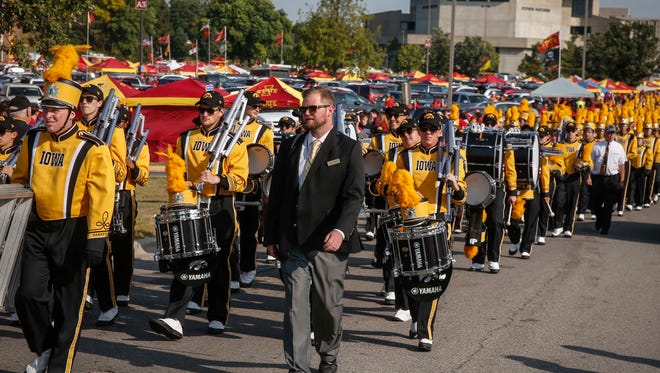 Members of the Iowa marching band make their way to Jack Trice Stadium on Saturday, Sept. 9, 2017, at Jack Trice Stadium in Ames, Iowa.