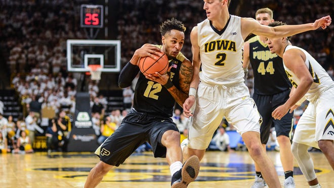 Jan 20, 2018; Iowa City, IA, USA; Purdue Boilermakers forward Vincent Edwards (12) goes to the basket as Iowa Hawkeyes forward Jack Nunge (2) defends during the first half at Carver-Hawkeye Arena. Mandatory Credit: Jeffrey Becker-USA TODAY Sports