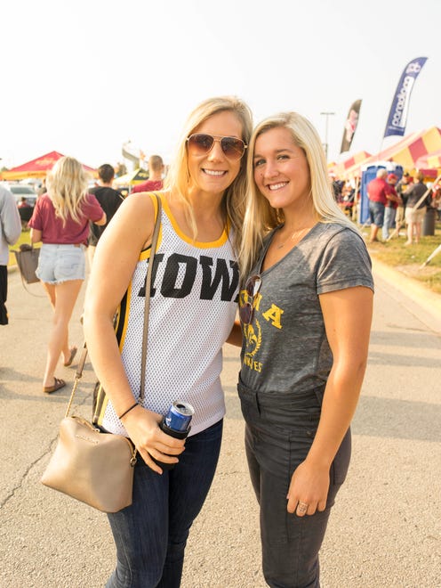 Trisha Fopma, 22, and Haley Hoffman, 22, both of Cedar Rapids, showing support for the hawkeyes at the 2017 Iowa Vs. Iowa State Game.