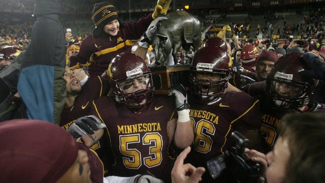 Minnesota celebrates with the Floyd of Rosedale trophy after their 27-24 victory over Iowa on Nov. 27, 2010, at TCF Bank Stadium, in Minneapolis. Press-Citizen file photo
Minnesota celebrates with the Floyd of Rosedale trophy after their 27-24 victory over Iowa, Saturday, Nov. 27, 2010, at TCF Bank Stadium, in Minneapolis, Minn.