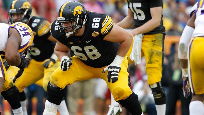 From 2013: Iowa Hawkeyes offensive linesman Brandon Scherff (68) lines up for a play against LSU Tigers in the 2014 Outback Bowl.