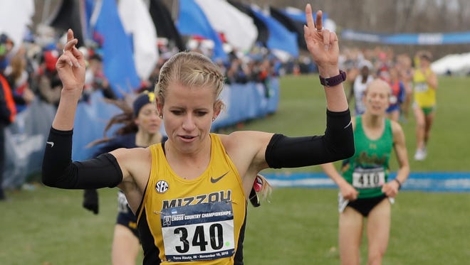Missouri's Karissa Schweizer reacts after winning the women's NCAA Division I Cross-Country Championships Saturday, Nov. 19, 2016, in Terre Haute, Ind.