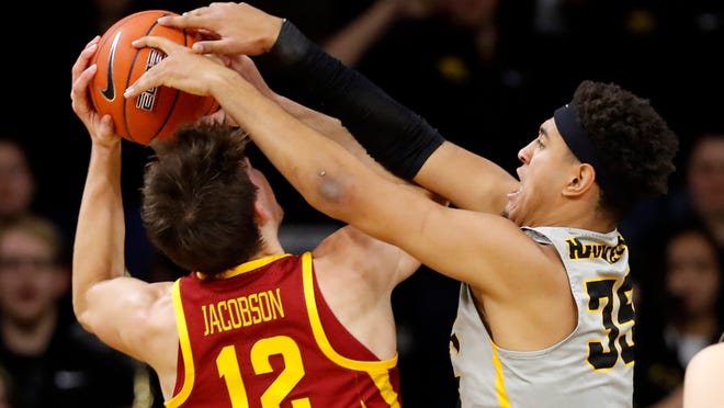Iowa State forward Michael Jacobson (12) is fouled by Iowa forward Cordell Pemsl during the second half of an NCAA college basketball game, Thursday, Dec. 6, 2018, in Iowa City, Iowa. (AP Photo/Charlie Neibergall)