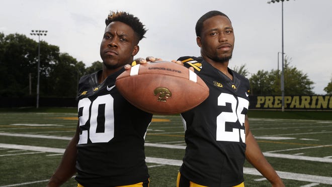 James Butler (20) and Akrum Wadley have big plans for their senior year together as Iowa tailbacks.