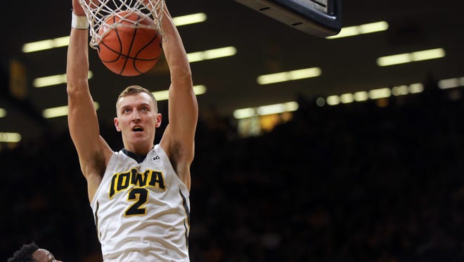 Iowa's Jack Nunge dunks the ball during the Hawkeyes' game against Chicago State at Carver-Hawkeye Arena on Friday, Nov. 10, 2017.