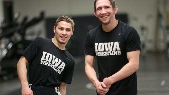 Iowa's Spencer Lee chats with Matt McDonough before practice at Carver-Hawkeye Arena on Wednesday, Jan. 3, 2018.