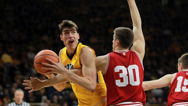 Iowa's Luka Garza fights his way to the basket during the Hawkeyes' game against Indiana at Carver-Hawkeye Arena on Saturday, Feb. 17, 2018.
