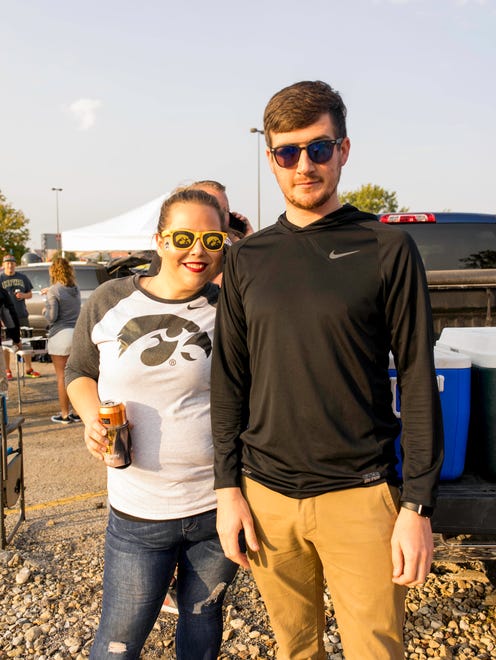 Morgan Scholl, 28, and Nathan Miner, 28, both of Des Moines, having a fun time tailgating at the 2017 Iowa Vs. Iowa State Game.