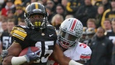 Derrell Johnson-Koulianos (2007-2010) redshirted in 2006 and went on to rank first at Iowa with 173 career receptions and second with 2,616 yards when he left the program. He is pictured making a catch against Ohio State on Nov. 20, 2010 at Kinnick Stadium.