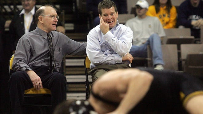 Iowa assistant coach Dan Gable jokes with head coach Tom Brands during the 149 lb match of their home dual against Arizona State Saturday November 25,2006 at Carver Hawkeye Arena, in Iowa City.