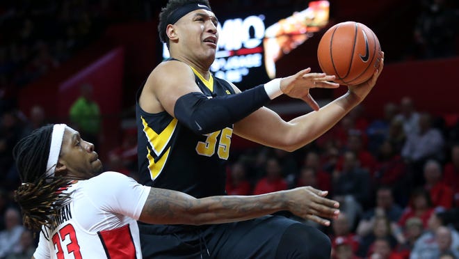 Iowa forward Cordell Pemsl (35) goes up for a basket past Rutgers forward Deshawn Freeman (33) during the first half of an NCAA college basketball game, Tuesday, Jan. 31, 2017, in Piscataway, N.J. (AP Photo/Mel Evans)