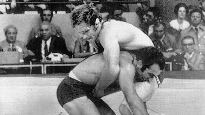 A golden moment: Dan Gable battles Ruslan Ashuraliev of the Soviet Union during the 1972 Olympic Games in Munich. The Iowan's 3-0 victory gave him the gold medal.