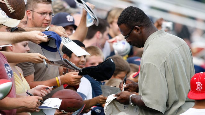 From 2008: New England Patriots  former linebacker Andre Tippett signs some autographs at the conclusion of training camp at the practice field of Gillette Stadium in Foxboro.  Tippett was inducted into the football hall of fame on Saturday August 2, 2008.
