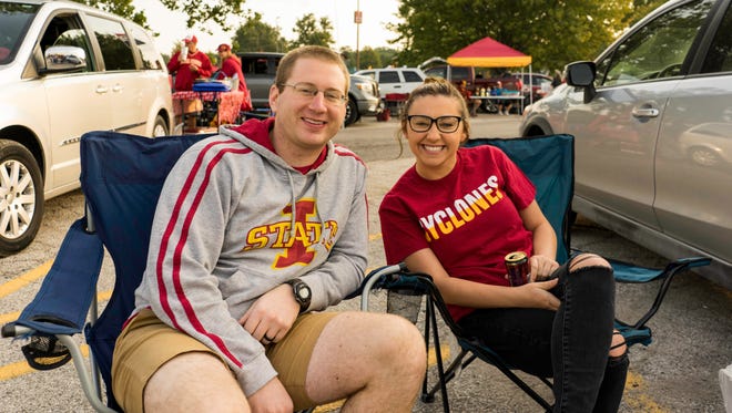 Thomas McLoughlin, 27, and Meaghon Holyfield, 21, both of Kansas City, having a fun time tailgating at the 2017 Iowa Vs. Iowa State Game.