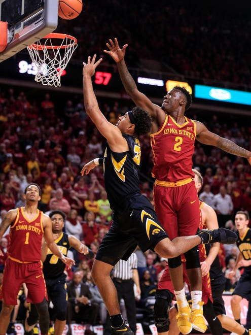 Iowa Hawkeyes forward Cordell Pemsl (35) puts up a shot while Iowa State Cyclones forward Cameron Lard (2) defends as the Hawkeyes take on the Cyclones in Ames Thursday, Dec. 7, 2017.