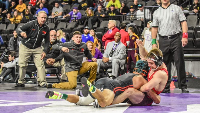 Oregon State's Ronnie Bresser connected on an inside trip to score a takedown and beat Iowa's Spencer Lee, 3-1, at the 55th annual Ken Kraft Midlands Championships on Saturday, Dec. 30, 2017, in Evanston, Illinois. Bresser reached the finals at 125 pounds while Lee defaulted out of the tournament.