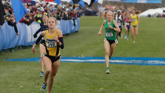 Missouri's Karissa Schweizer (340) runs towards the finishing line in the women's NCAA Division I Cross-Country Championships Saturday, Nov. 19, 2016, in Terre Haute, Ind. Schweizer won the race.