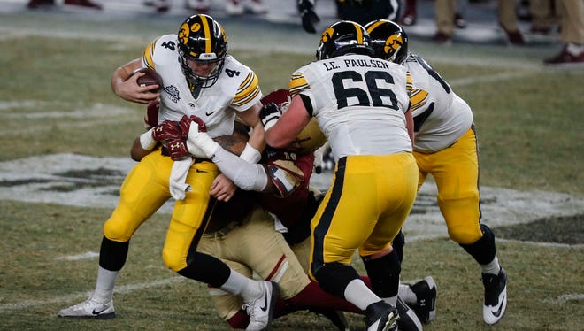 Iowa quarterback Nate Stanley is sacked by the Boston College defense during the 2017 Pinstripe Bowl at Yankee Stadium in Bronx, New York on Wednesday, Dec. 27, 2017.