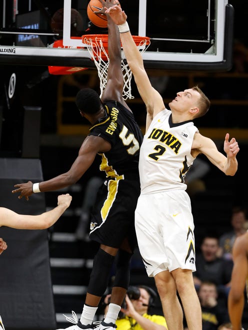 Iowa forward Jack Nunge (2) goes up to try block a shot by Alabama State guard Tobi Ewuosho  on Sunday. Nunge finished with three steals and two blocks to key a strong defensive effort in Iowa's 92-58 win.