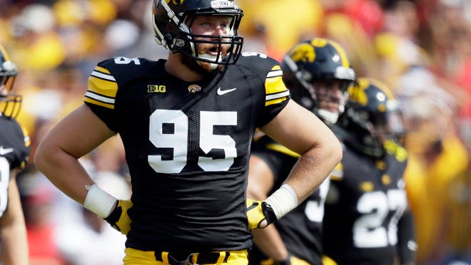 FILE - In this Sept. 5, 2015, file photo, Iowa defensive lineman Drew Ott stands at the line of scrimmage during the first half of an NCAA college football game against Illinois State in Iowa City, Iowa. Ott's college career is finished after his appeal for an extra year of eligibility was denied by the NCAA. Hawkeyes coach Kirk Ferentz confirmed the NCAA's decision Wednesday, April 12, 2016, saying he was disappointed in both the decision and the process. (AP Photo/Charlie Neibergall, File)
